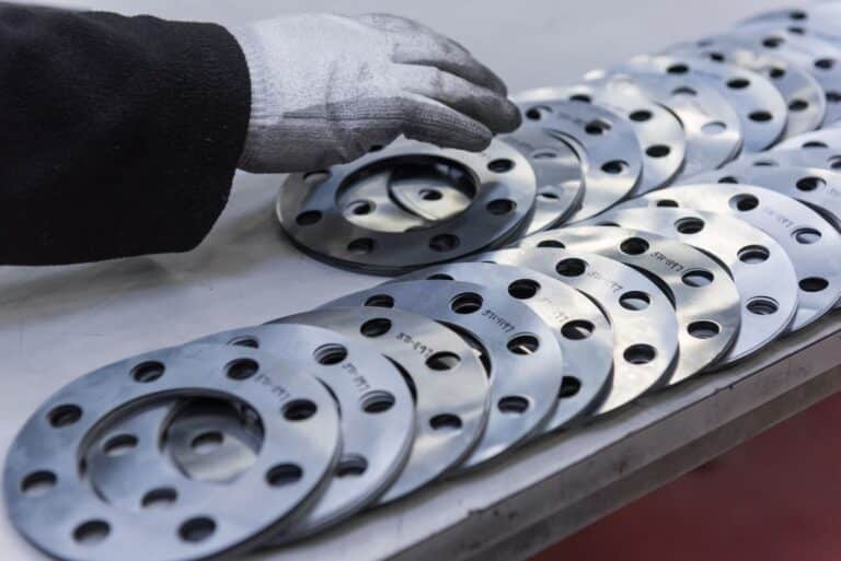 Stahlbau-engineers-hand-arranging-cut-parts-in-engineering-2024-10-22-10-38-08-utc